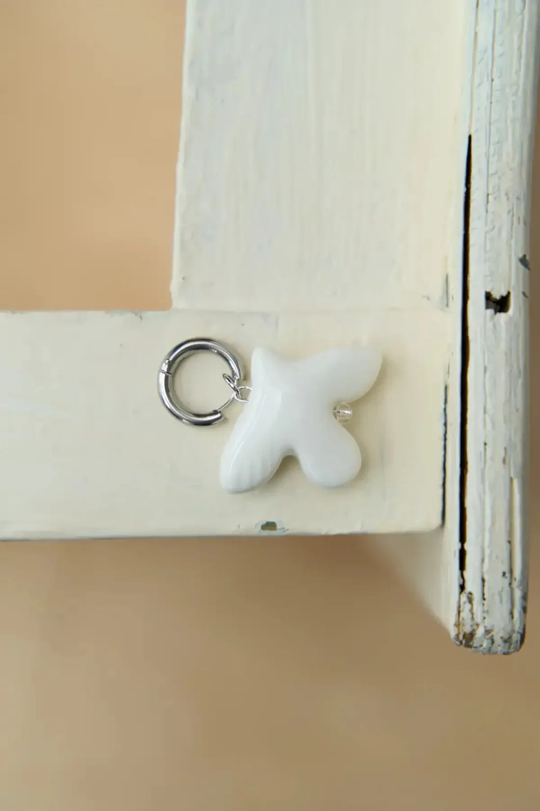 MYRNI single earring with a bird, silver hardware