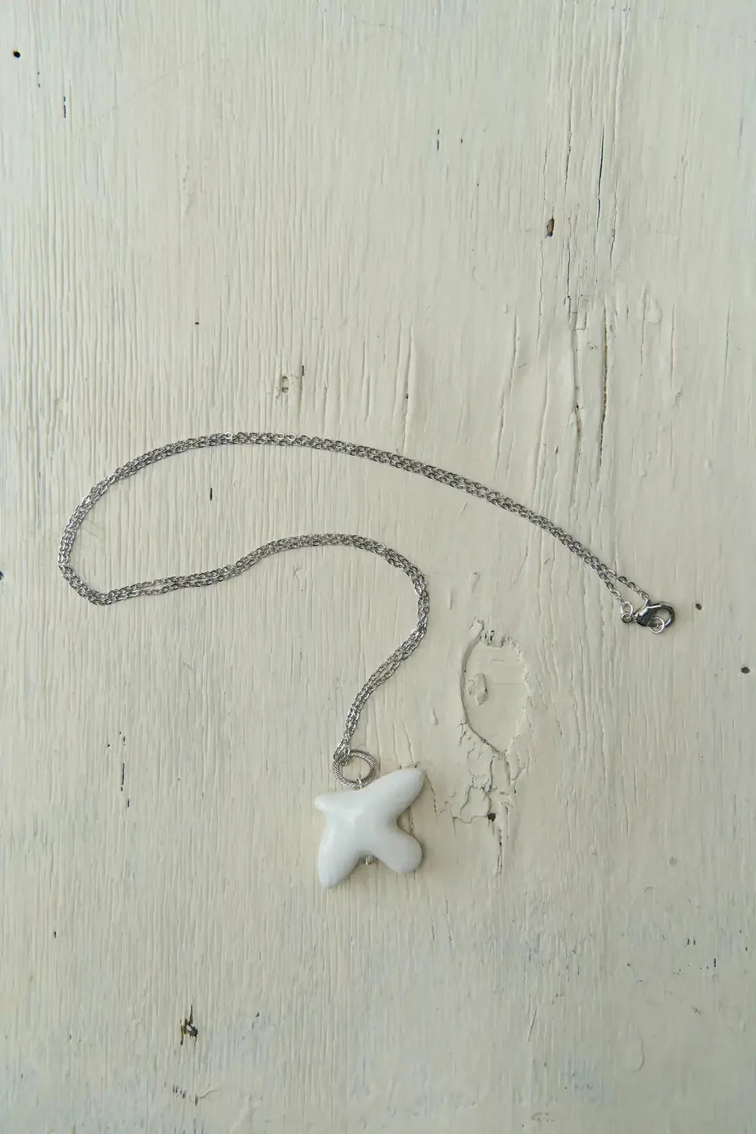 MYRNI pendant with a bird on a chain, silver hardware